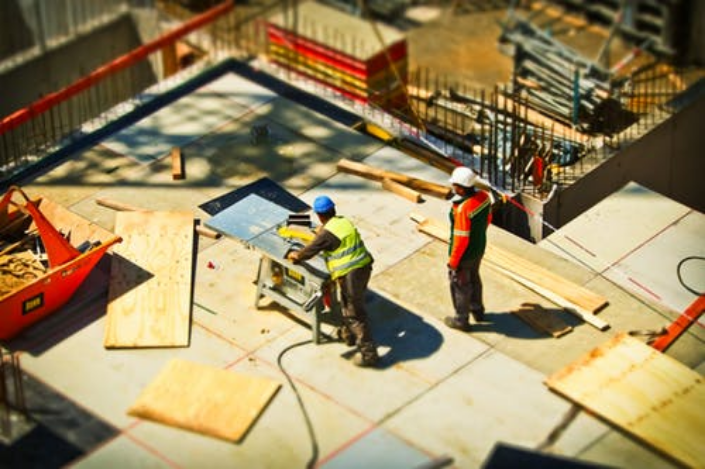 two workers on a construction site